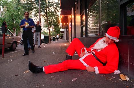 Santa having one too many cold ones. A weary Santa the morning after an all-night pub crawl.