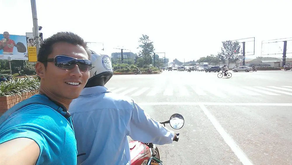 Riding on the boda boda with my guide, Michael.